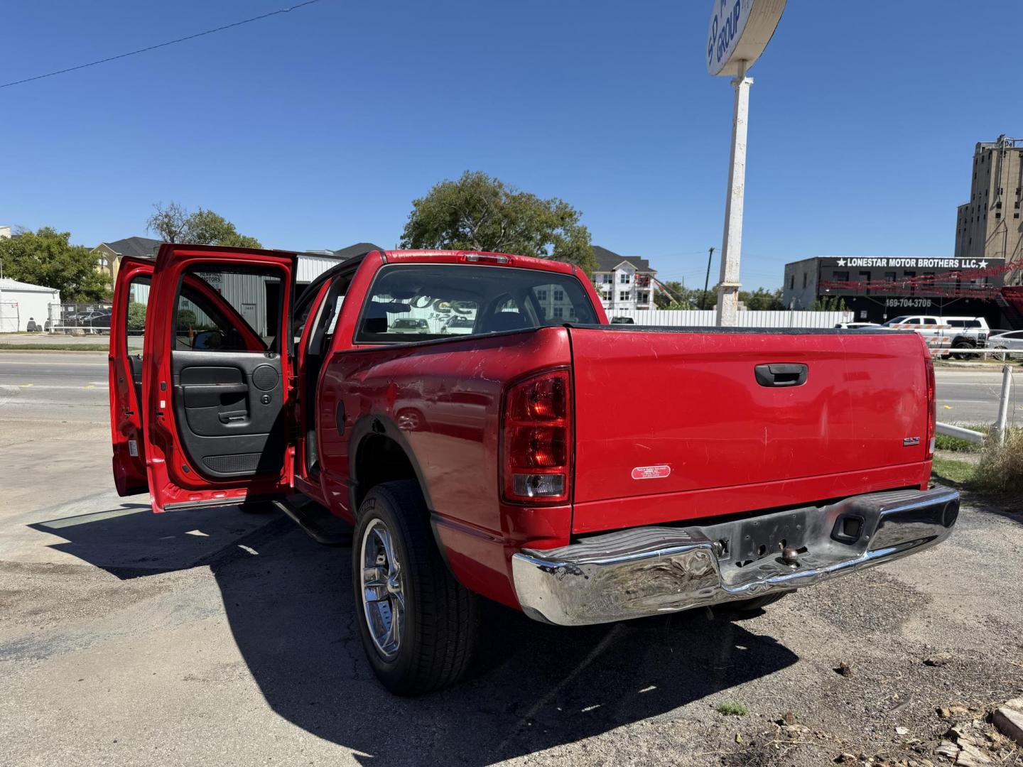 2004 Red Dodge Ram 1500 Laramie Quad Cab 2WD (1D7HA18N54S) with an 4.7L V8 SOHC 16V engine, Automatic transmission, located at 3624 Hemphill St., Fort Worth, TX, 76110, (817) 926-8921, 32.696205, -97.331985 - Photo#5