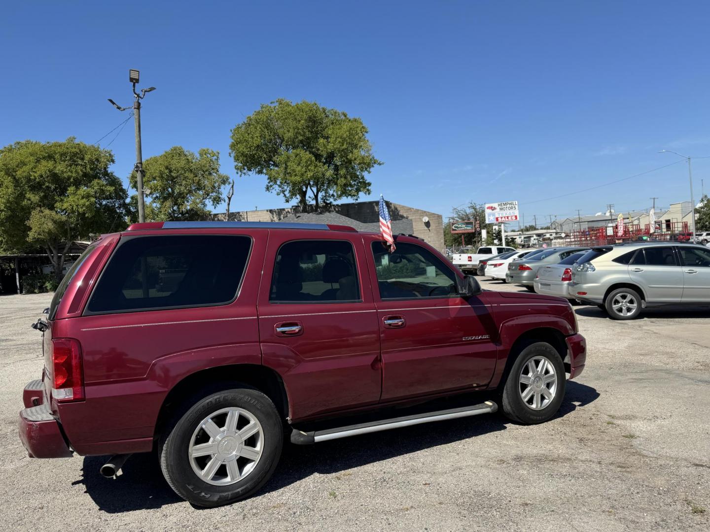 2005 Maroon Cadillac Escalade 2WD (1GYEC63N95R) with an 6.0L V8 OHV 16V engine, Automatic transmission, located at 3624 Hemphill St., Fort Worth, TX, 76110, (817) 926-8921, 32.696205, -97.331985 - Photo#2