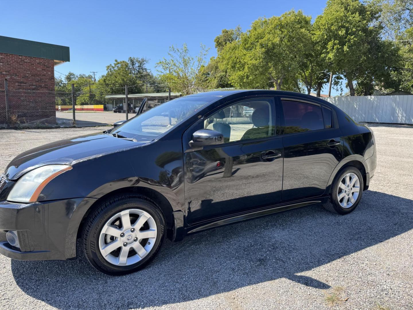 2012 Black Nissan Sentra 2.0 (3N1AB6AP7CL) with an 2.0L L4 DOHC 16V engine, Automatic transmission, located at 3624 Hemphill St., Fort Worth, TX, 76110, (817) 926-8921, 32.696205, -97.331985 - Photo#0