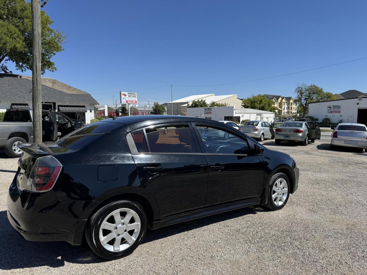 2012 Black Nissan Sentra 2.0 (3N1AB6AP7CL) with an 2.0L L4 DOHC 16V engine, Automatic transmission, located at 3624 Hemphill St., Fort Worth, TX, 76110, (817) 926-8921, 32.696205, -97.331985 - Photo#1